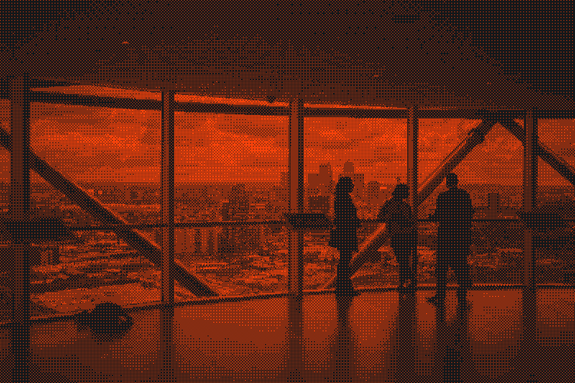 Three people look out at a cityscape